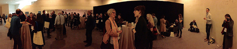 panaoramic scene of conference attendees