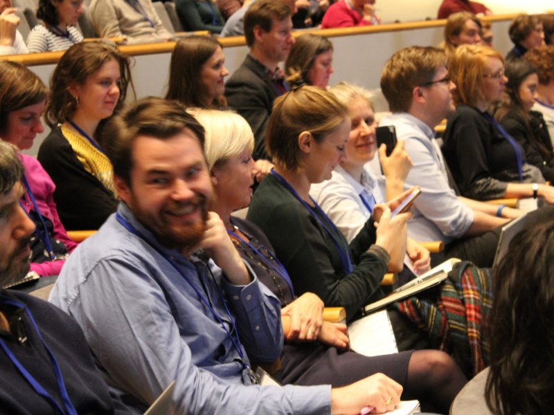 Audience members at a conference